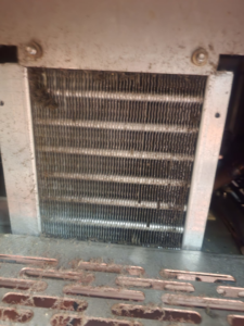A dirty and clogged HVAC or refrigeration coil requiring cleaning or service by Facility Doctors in Raleigh, NC