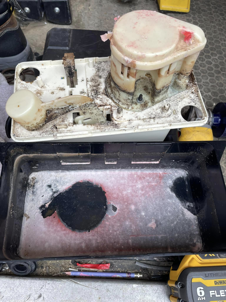 A dirty condensate pump disassembled for maintenance, showcasing HVAC service by Viking Mechanical LLC in Rapid City, SD.
