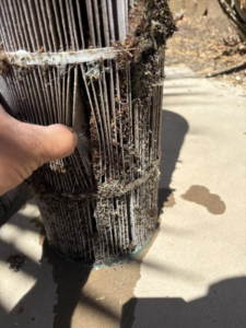 A close-up of a dirty and damaged pool filter cartridge, showing the need for professional pool care from Aquatec Pool Care in Jacksonville, FL.