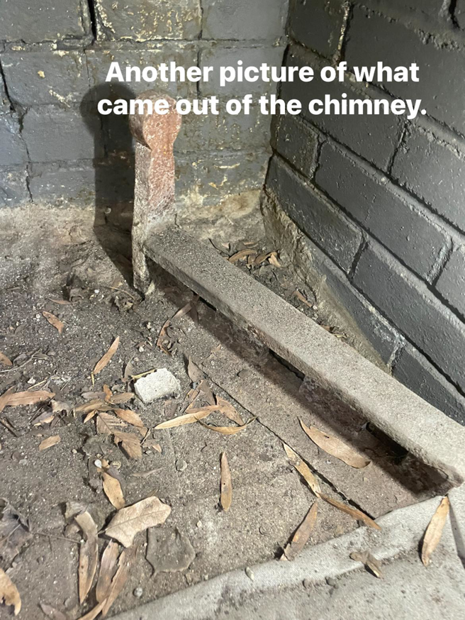 A dirty fireplace with leaves and debris, showing the condition before a chimney sweep by Southern Chimney and Duct Clean in Monroe, LA.