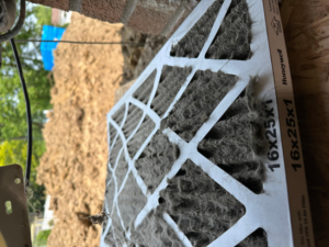 A very dirty HVAC air filter, indicating a need for replacement, by Cardinal Repairs in Canton, OH
