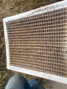 A very dirty HVAC air filter, indicating the need for replacement or cleaning by Elite Air Pros in Yukon, OK.