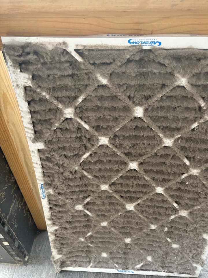 A heavily soiled HVAC air filter, indicating the need for replacement or cleaning by KATS Heating & Cooling in La Grange Park, IL.