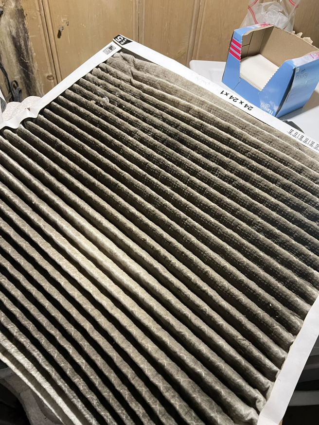 A very dirty HVAC air filter needing replacement by Evans Heat & Air in Ruther Glen, VA.