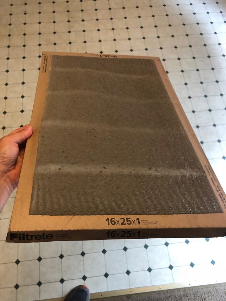 A dirty HVAC air filter, showing the importance of regular replacement by G&G Heating and Air in Portage, MI.