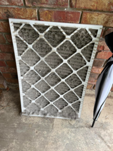 A very dirty HVAC air filter showing the need for replacement by Hawthorne Heat & Air in Pollock, LA.