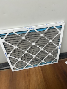 A very dirty HVAC air filter ready for replacement by Pepeta Service Inc. in Clayton, DE