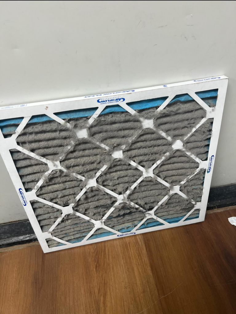 A very dirty HVAC air filter ready for replacement by Pepeta Service Inc. in Clayton, DE