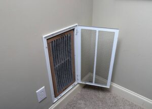 A dirty HVAC air filter in a return vent, indicating a need for replacement by Rhode Island HVAC Services in Providence, RI.