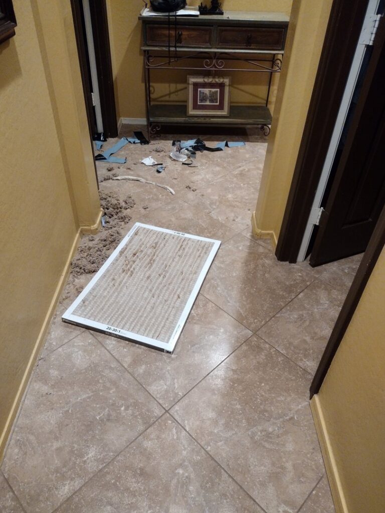 A dirty HVAC air filter removed for replacement during maintenance by Service Experts Phoenix in Phoenix, AZ.