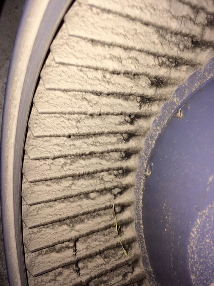 Close-up of dirty HVAC blower fan blades needing professional cleaning by Bergmann Heating & Air Conditioning, LLC in Orem, UT