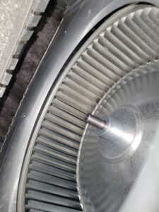 A close-up of a dirty HVAC blower fan requiring cleaning by Comfort Hounds Heating & Cooling in Raleigh, NC.