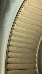 A close-up view of a dirty HVAC blower fan, indicating the need for cleaning by Midwest Air Solutions in Indianapolis, IN