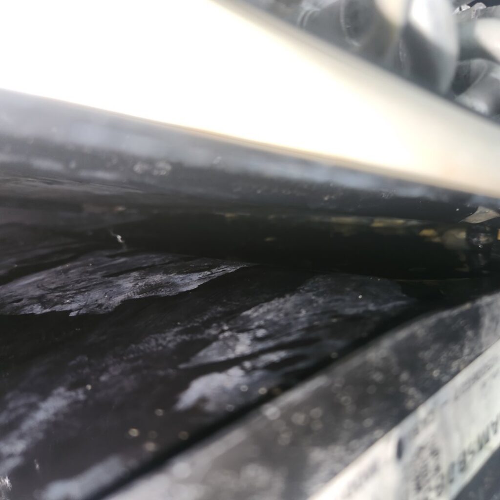 A close-up of a dirty HVAC coil or drain pan requiring service by Southwest Florida Air Quality in Cape Coral, FL