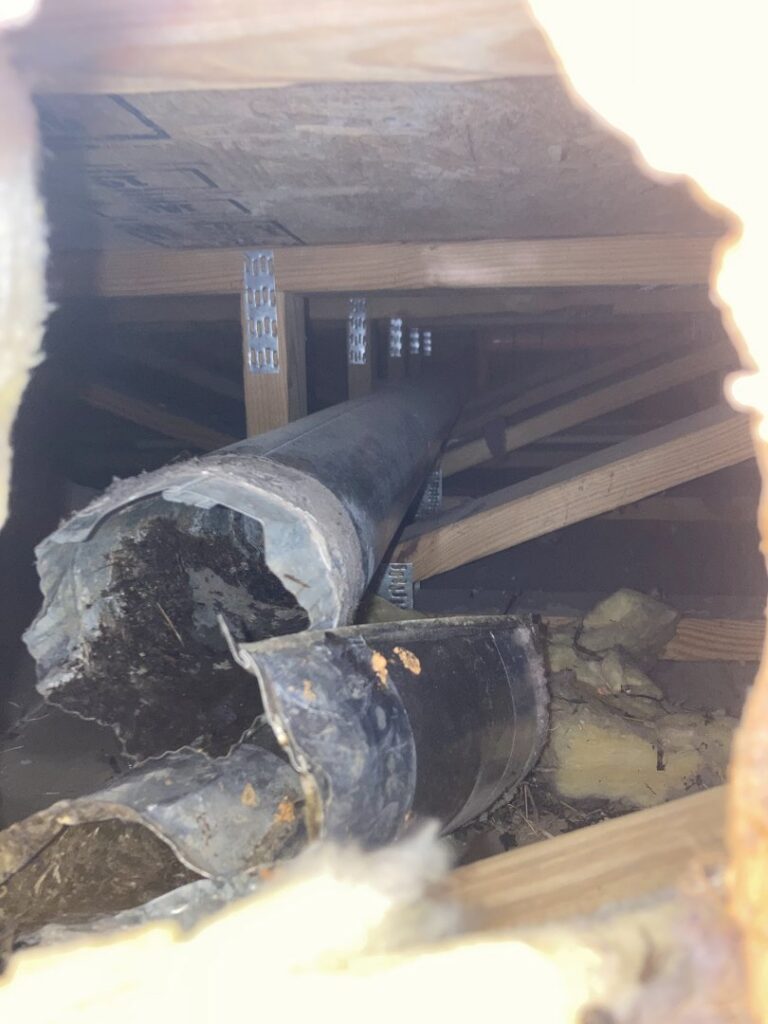 The interior of an HVAC unit showing a dirty component, likely a fan or coil, requiring cleaning by Star Quality Air Duct Cleaning in Silver Spring, MD.
