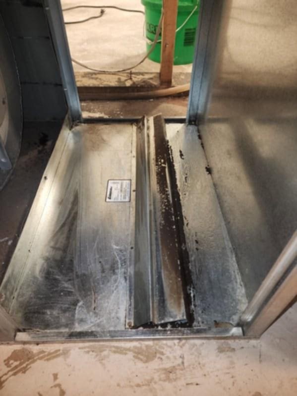 Dirty HVAC system interior with grime and debris, indicating a need for professional cleaning by DUCTZ of Siouxland in Vermillion, SD.