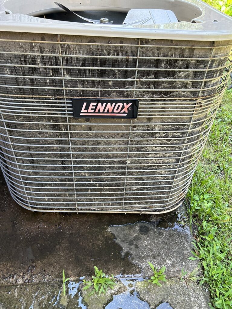 A dirty Lennox outdoor AC unit showing the need for cleaning or maintenance by Oklahoma Climate Solutions in Oklahoma City, OK.