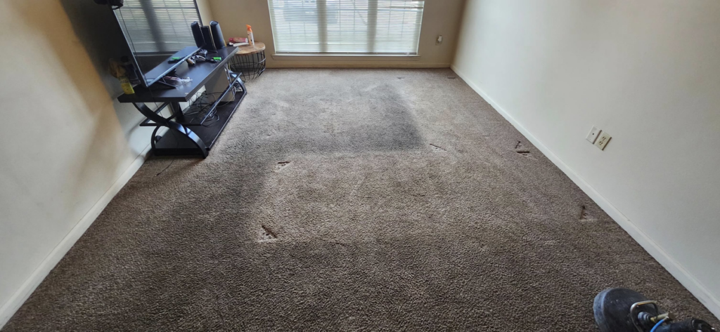 A dirty living room carpet before professional cleaning by Top Notch Cleaning, LLC in Bensalem, PA.