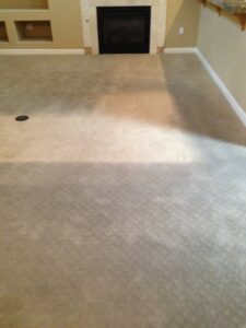 Dirty carpet in a living room with a fireplace before cleaning by Revolution Carpet Cleaners in Chandler, AZ