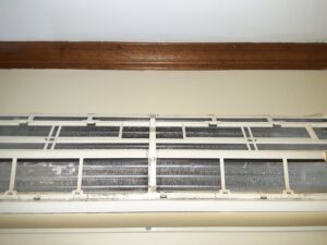 Close-up of dirty coils inside a mini-split unit, ready for cleaning by Elements Heating & Cooling LLC in Minneapolis, MN.