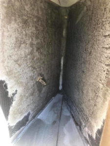 Extremely dirty and moldy HVAC evaporator coils needing cleaning, a service provided by Bergmann Heating & Air Conditioning, LLC in Orem, UT