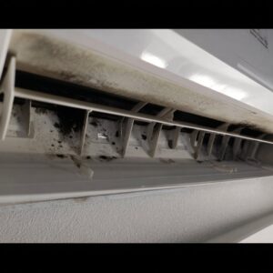 A dirty and moldy mini-split indoor unit requiring cleaning by Black Oak HVAC in Derry, NH
