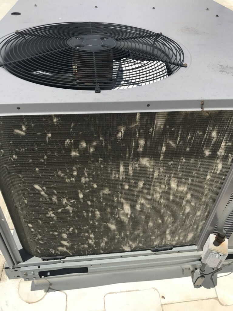 A close-up of a dirty outdoor air conditioning coil needing maintenance from Epic Heating & Cooling in Wichita, KS.