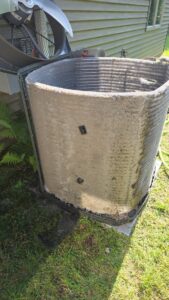 A heavily soiled outdoor AC condenser coil requiring cleaning or maintenance from TruTemp Heating & Cooling LLC in Ijamsville, MD.