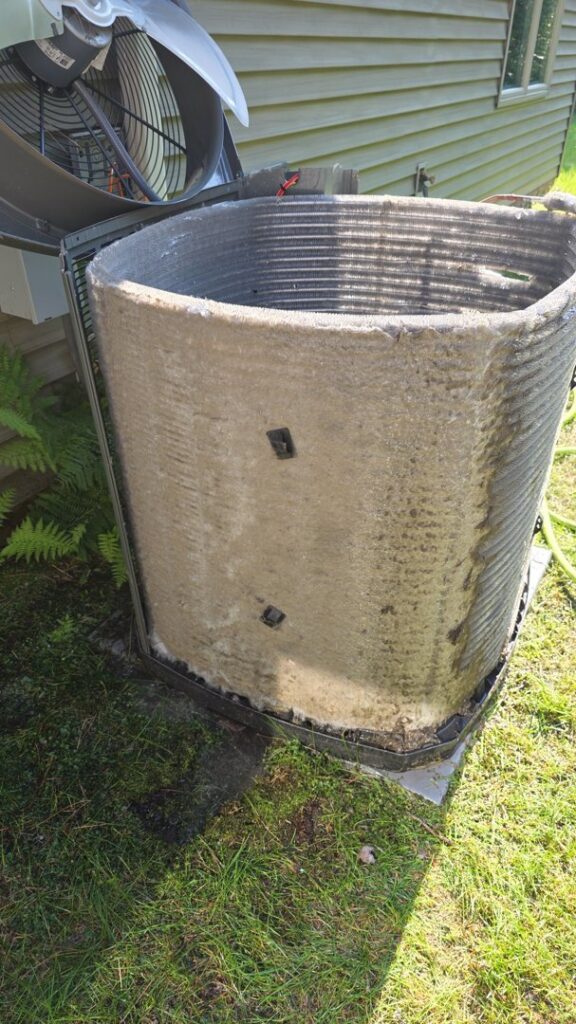 A heavily soiled outdoor AC condenser coil requiring cleaning or maintenance from TruTemp Heating & Cooling LLC in Ijamsville, MD.