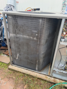 A dirty outdoor AC condenser unit requiring service from Rite Way Heating, Cooling & Plumbing of Phoenix, AZ.