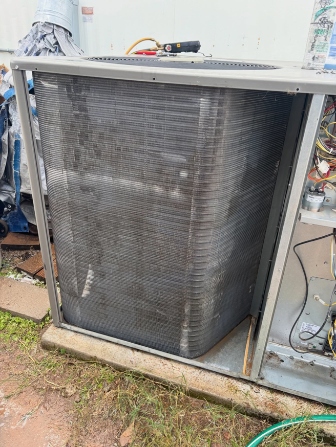 A dirty outdoor AC condenser unit requiring service from Rite Way Heating, Cooling & Plumbing of Phoenix, AZ.
