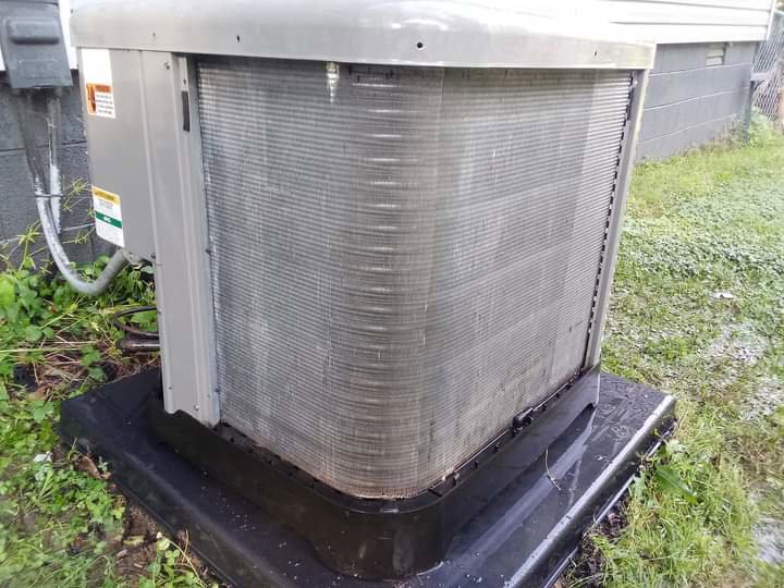 A dirty outdoor AC condenser unit, indicating a need for cleaning or service by TAG Heat N Air in North Little Rock, AR.