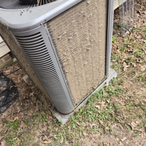 A very dirty outdoor HVAC unit needing cleaning from Seven 2 Seven Mechanical LLC in Concord, NC.