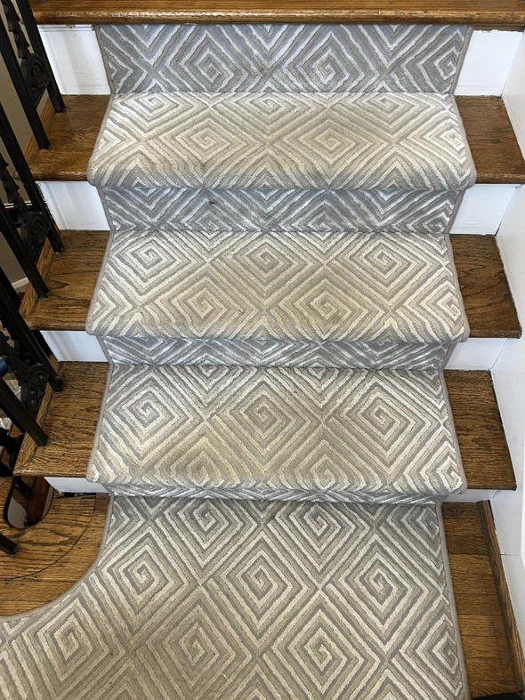 Dirty patterned carpet on stairs before cleaning by Roberts Cleaning Services in Zionsville, IN.