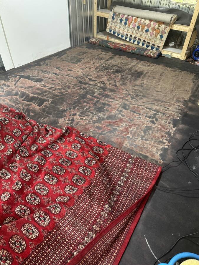 A very dirty rug on the floor, indicating the need for professional cleaning or restoration by C&R's Carpet Cleaning in Ellsworth, ME.