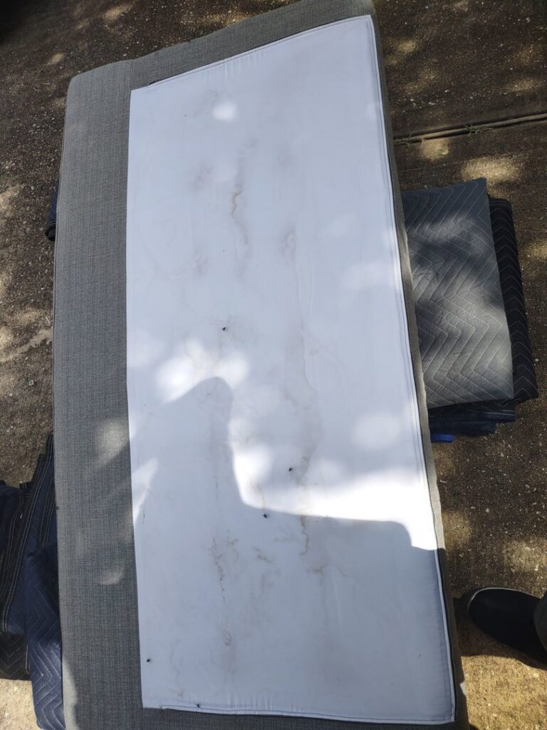 A dirty and stained mattress or cushion before cleaning by Tex A Clean Carpet Care in League City, TX.