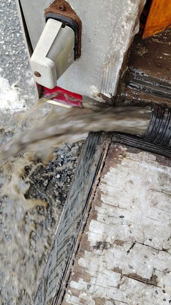 Dirty water being extracted from a professional cleaning machine during a job by D&D Carpet Cleaning & Janitorial in West Columbia, SC