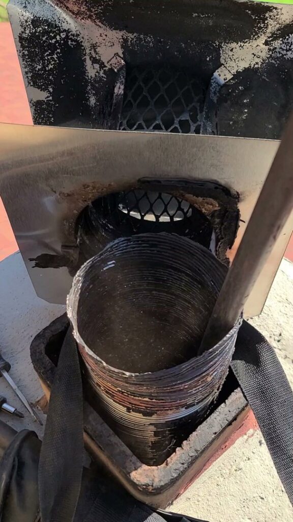 The interior of a wood stove filled with ash and soot, indicating a need for cleaning by Eagles Nest Chimney Services and more of Cincinnati LLC in Cincinnati, OH.