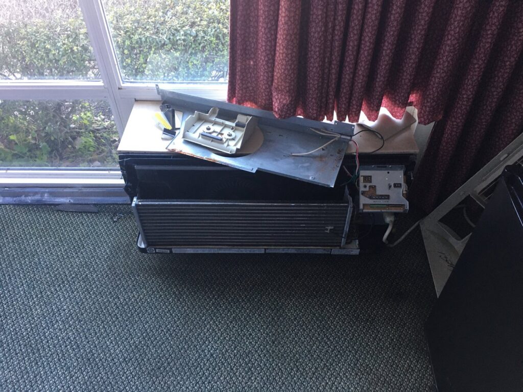 A disassembled window air conditioning unit undergoing repair by The A/C Guy in Shreveport, LA.