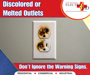 A close-up of a discolored and melted electrical outlet, indicating a hazard that Electric MD can repair in St. Charles, MO.