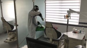 Ideal Pest Control Inc performing disinfection service in a medical office setting in Miami, FL.