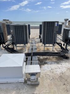 A white display cabinet with interior lighting showcasing items, installed by Johnson Electric in Port Angeles, WA.