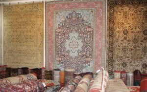 A diverse collection of rugs displayed in the showroom at Ebie's Rug Cache & Ebie's Rug Cleaning in Tucson, AZ