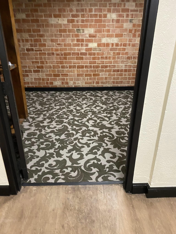 View through a doorway showing patterned carpet installed by Top Quality Floors LLC in Oklahoma City, OK.