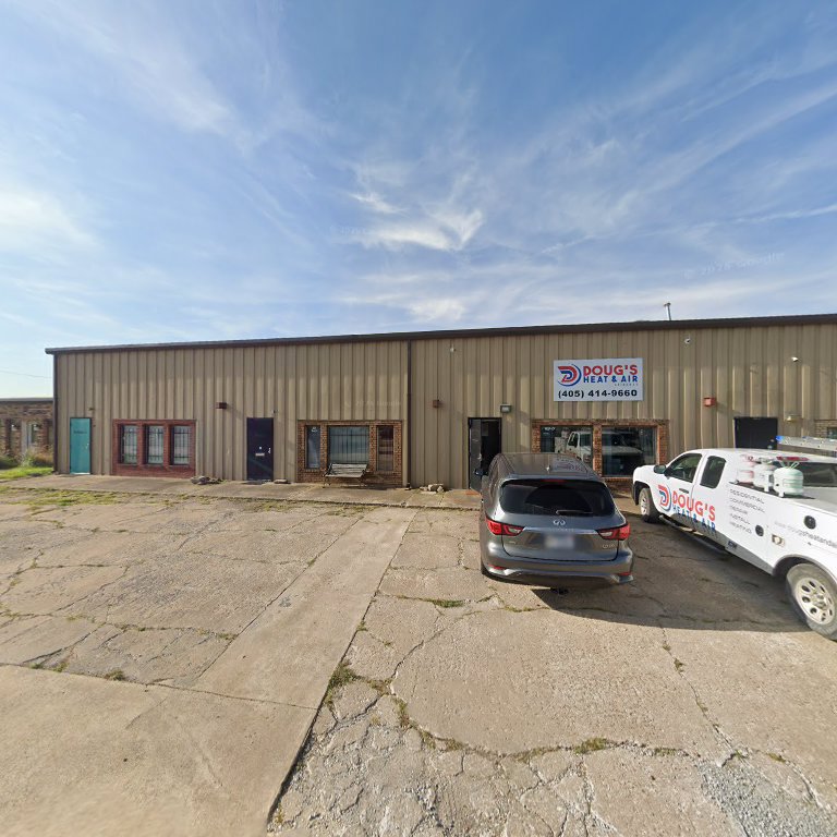 Exterior view of Doug's Heat & Air business location with a service truck parked outside in Norman, OK
