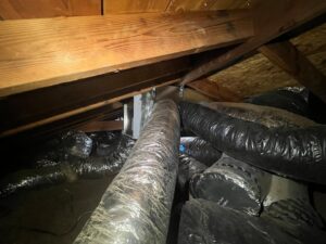 A close-up of a drain pipe connection, showing plumbing work by McCutcheon & Sons Air Conditioning and Plumbing in Tempe, AZ