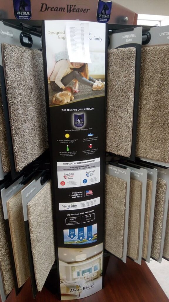 A DreamWeaver carpet samples display featuring various textures and colors at Southwest Floors in Seven Hills, OH.