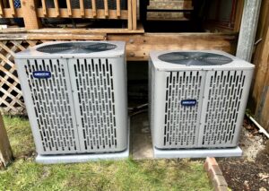 Two Ameristar outdoor air conditioning units installed side-by-side by Adam's HVAC in Naperville, IL.
