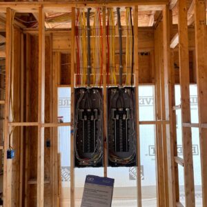 Installation of dual electrical panels and wiring during new construction by J&M Electrical Services in Stockbridge, GA.