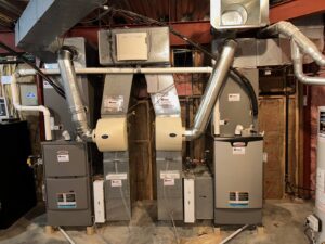Dual HVAC furnace and air handler installation with ductwork by Davenport Service Company in Olathe, KS